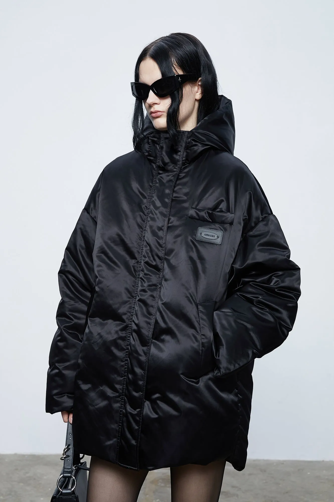 Loose hooded puffer jacket with inner quilting